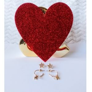 two pairs of golden earrings of fantasy